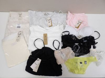 a lot of underwear on a table with a tag on it