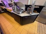 a kitchen with a counter with a mixer on it