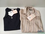 two men ' s shirts with tags on them sitting next to each other