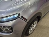 a close up of the front end of a silver car