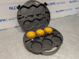 three yellow gears in a black case on a table