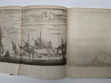 an open book with a drawing of a boat in the water