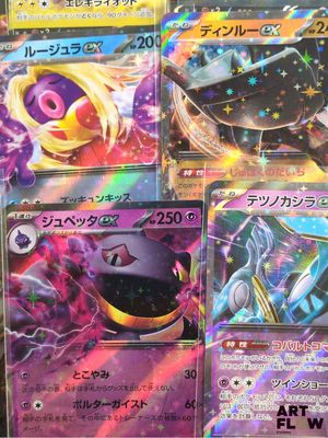 pokemon cards are lined up on a table in a store
