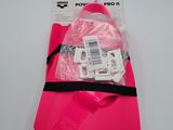 a close up of a pink bag on a white surface