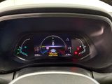the dashboard of a car with a digital display on it