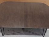 a close up of a table with a wooden top and metal legs