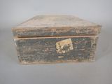 an old wooden box with a picture of a man on it