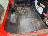 an image of a red truck with its bed down