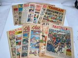 a lot of old comic books on the table