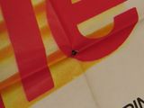 a close up of a book with a red and yellow logo on it