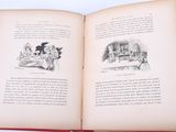 an open book with a picture of a man and a woman sitting at a table