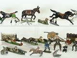 many figurines of horses and people on display