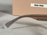 the glasses are made of metal and have a brown plastic frame