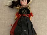 a doll that is laying down on a table