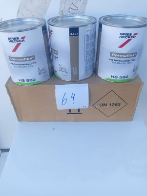 three cans of paint sitting on top of a cardboard box