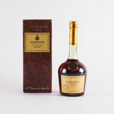 a close up of a bottle of wine next to a box