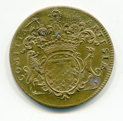 une vieille pièce de monnaie surmontée d'une couronne, posée sur un fond blanc