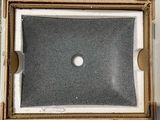 an open box with a hole in it sitting on top of a table