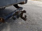 a close up of a truck ' s rear end with a wren on it