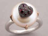 an image of a pearl ring with garnets and a heart
