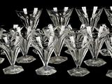 a lot of wine glasses that are sitting on a table