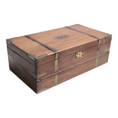 a small wooden box with a metal latch on it
