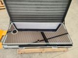 a suitcase that is sitting on a pallet on the ground