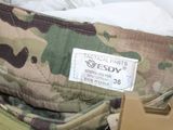 a close up of a camouflage bag with a tag on it