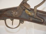 a close up of a gun on display in a museum