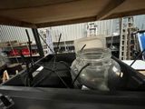 a jar of water sitting inside of a black container