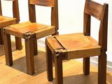 three wooden chairs sitting on a hard wood floor