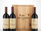 three bottles of wine in front of a wooden box