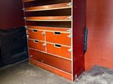 an image of a room that has a bunch of drawers in it