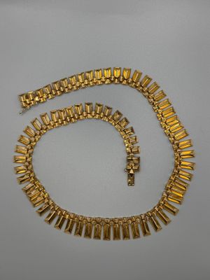 a gold necklace and bracelet set
