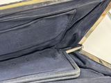 an open suitcase sitting on the floor with its lid open