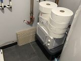 two rolls of toilet paper hanging on the wall in the bathroom