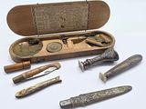 a wooden box with a variety of tools inside of it