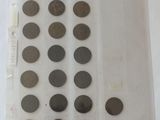 several different types of coins are displayed on a white surface