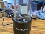 a blender that is sitting on a wooden table