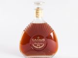 a bottle of camus brandy on a white background
