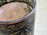 a close up of a vase on a table