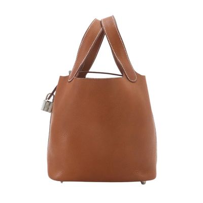 a brown handbag with two handles on a white background