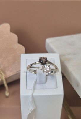 a ring that is sitting in a box on a table
