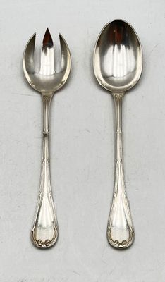two silver spoons and a spoon with a spoon handle