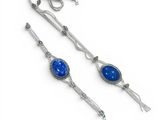a pair of silver and blue stone earrings