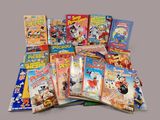 a lot of comic books that are on the table