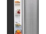 a close up of an open refrigerator with its door open