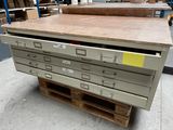 a lot of drawers on a pallet in a warehouse