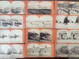 many old photographs of different buildings on display