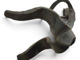 a close up of a metal object on a white surface